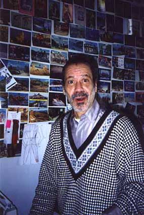 Frankie in his sewing room with postcards