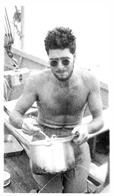 Ben cooking on deck